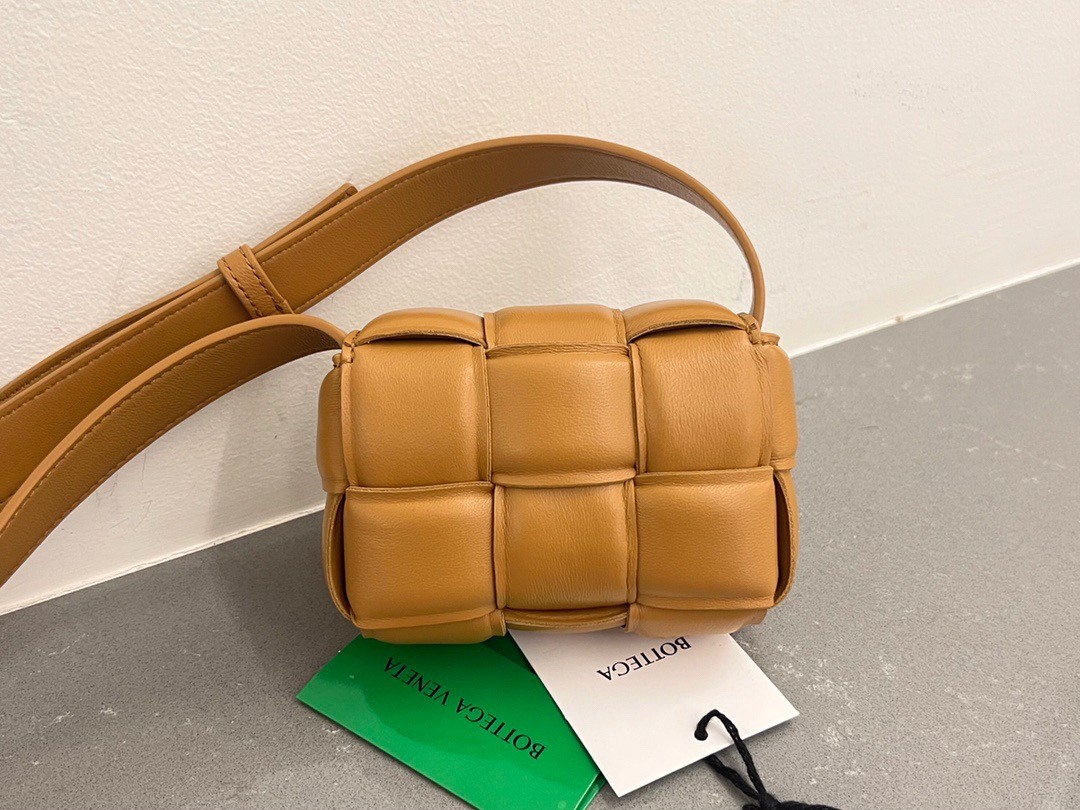 bo*te*ga Ve*ne*ta candy padded cassette bag in camel lambskin