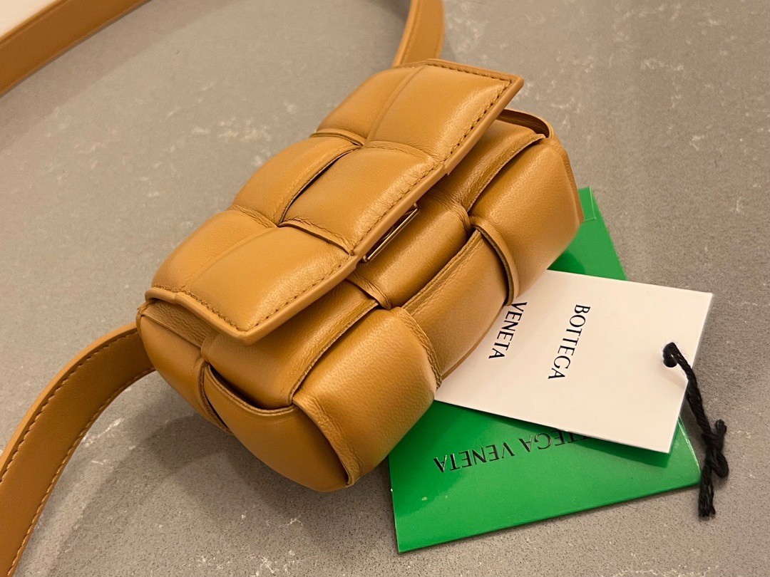bo*te*ga Ve*ne*ta candy padded cassette bag in camel lambskin