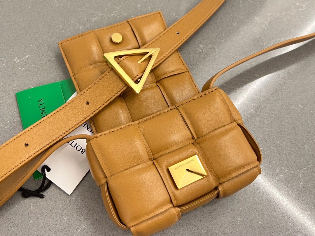 bo*te*ga Ve*ne*ta candy padded cassette bag in camel lambskin