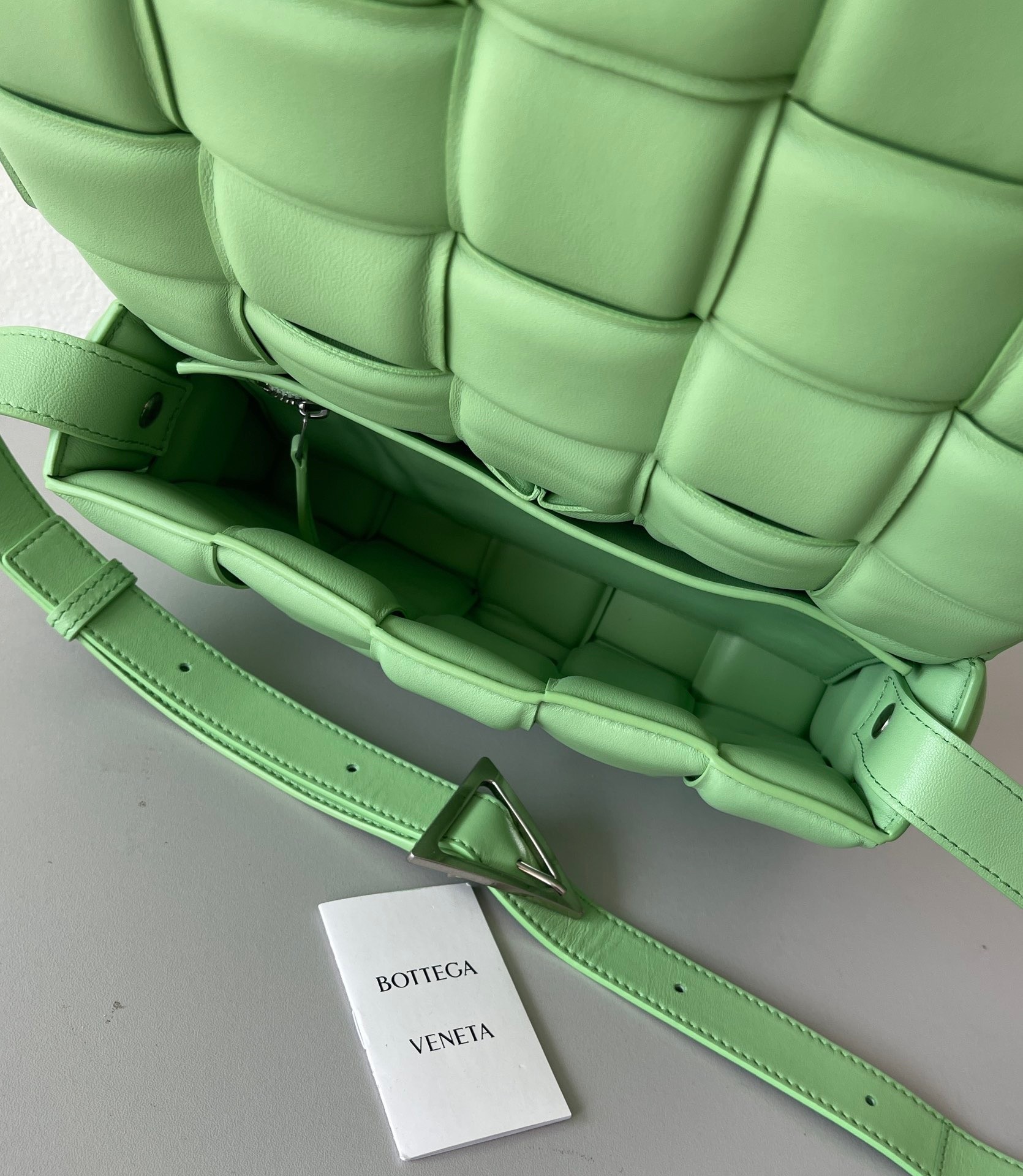 bo*te*ga Ve*ne*ta padded cassette bag in acid green lambskin