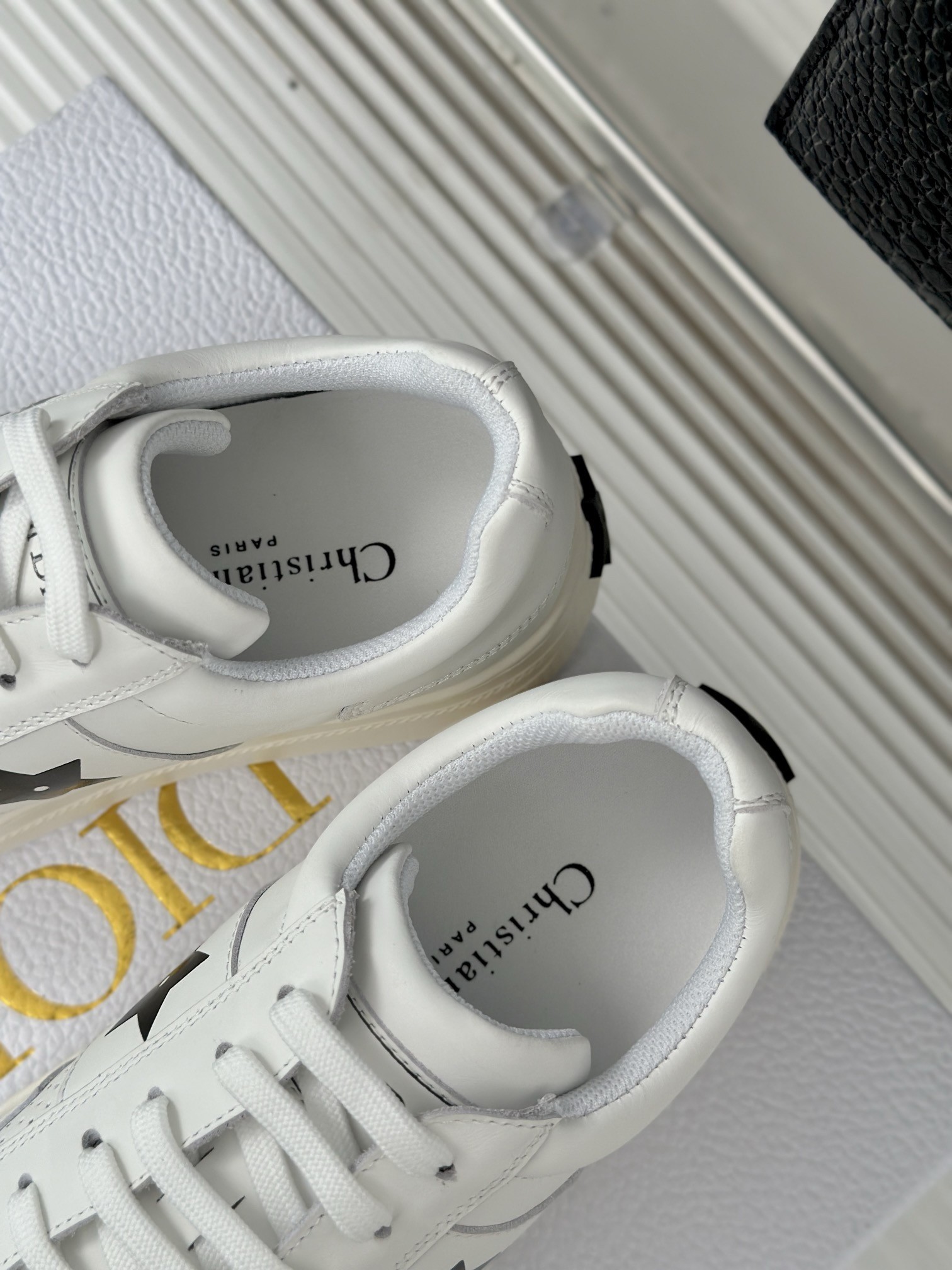 D*or star platform sneakers in white calfskin with black star