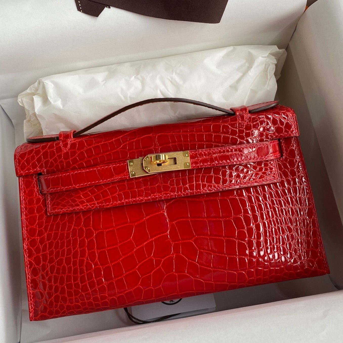 H**mes kelly pochette handmade bag in red shiny alligator leather