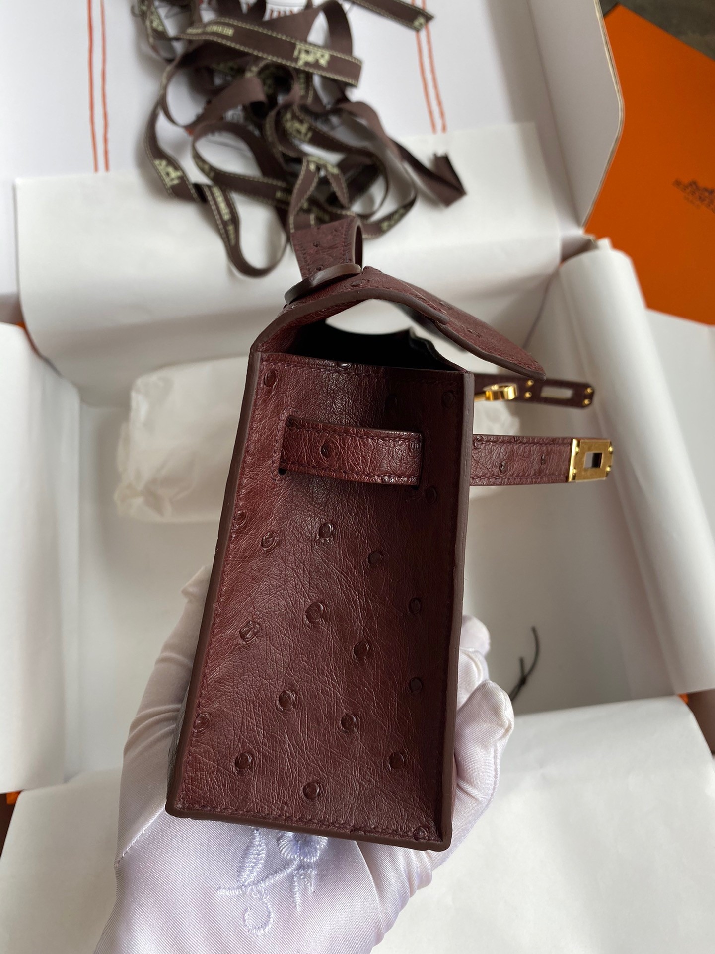 H**mes kelly pochette handmade bag in bordeaux ostrich leather