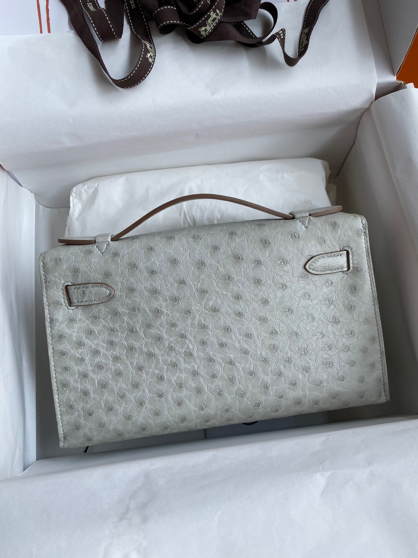 H**mes kelly pochette handmade bag in pearl grey ostrich leather