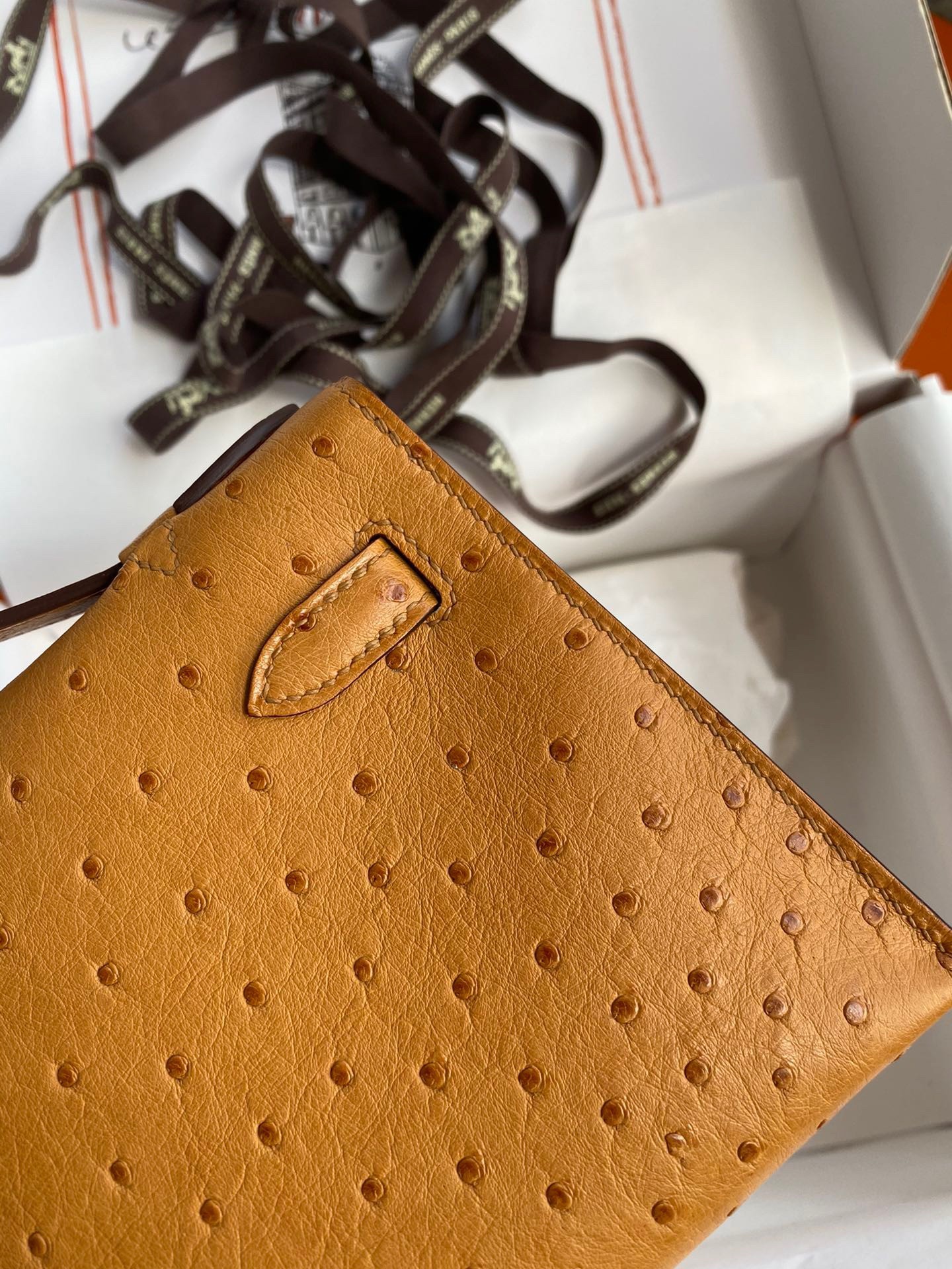 H**mes kelly pochette handmade bag in sesame ostrich leather