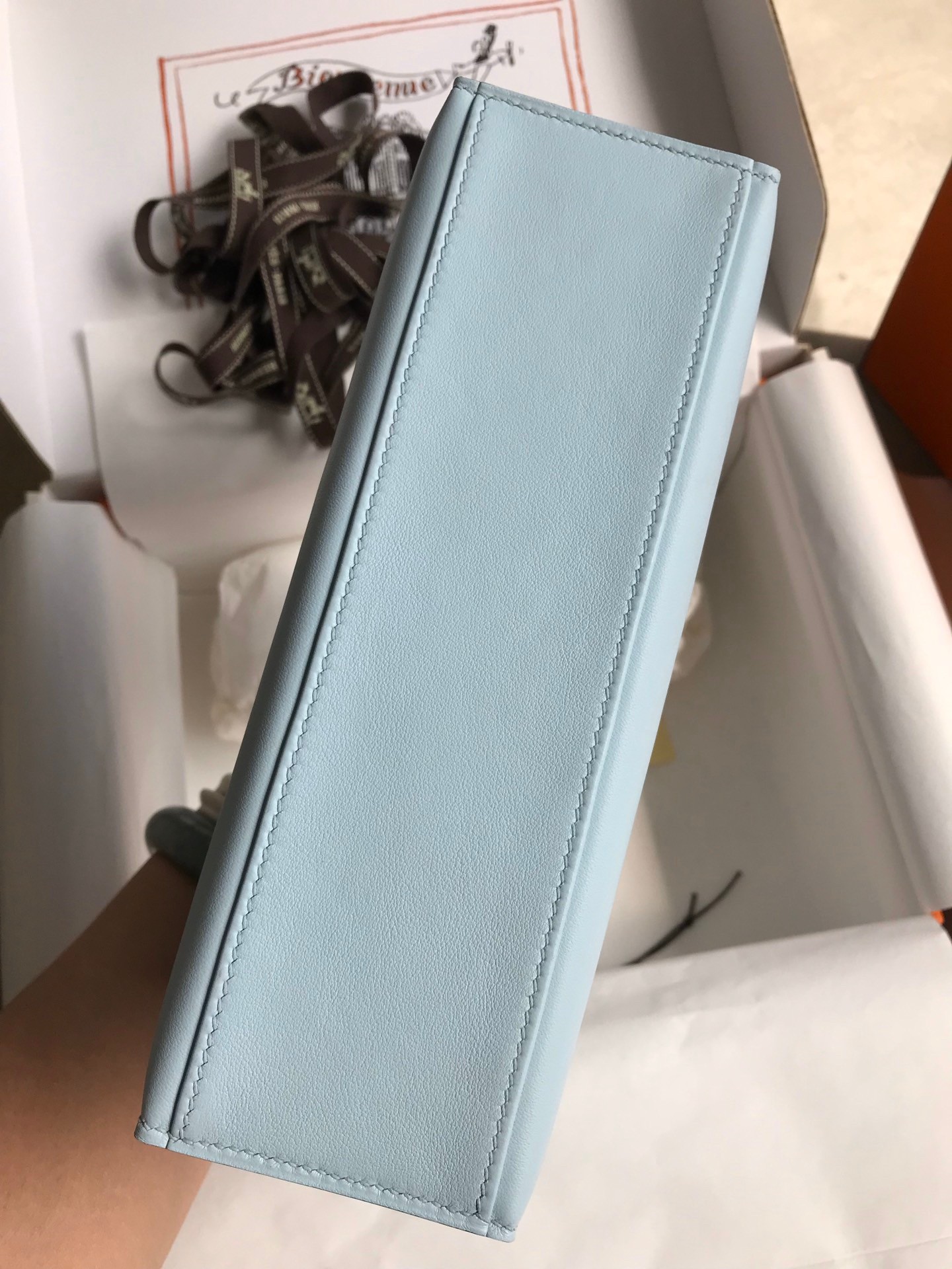 H**mes kelly pochette handmade bag in blue brume swift calfskin