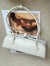 Alaia Le Teckel Medium Shoulder Bag in White Goatskin