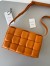 Bottega Veneta Padded Cassette Bag In Orange Lambskin