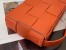 Bottega Veneta Cassett Bag In Orange Intrecciato Lambskin